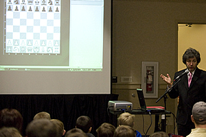 Gregory Kaidanov giving a chess lesson.